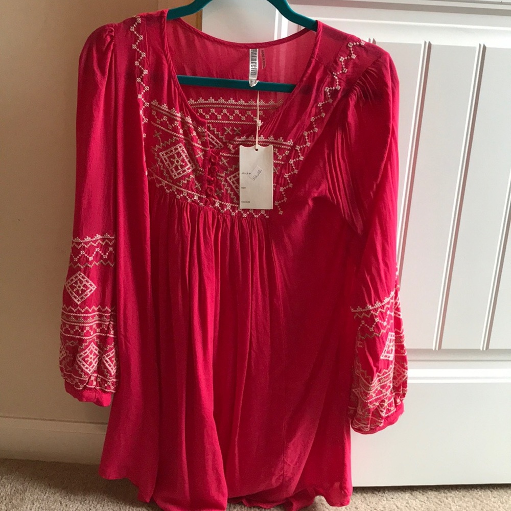 Pink dress with white embroidery